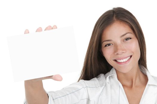 Blank white sign card. Young businesswoman holding white business card / empty paper sign with a lot of copy space. Beautiful mixed race chinese / caucasian woman isolated on seamless white background.