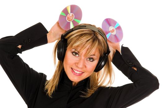 beautiful young woman listening music in headphones and holding two CD 