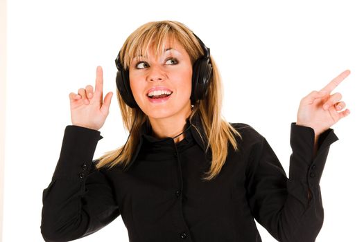 beautiful smiling young woman listening music in headphones