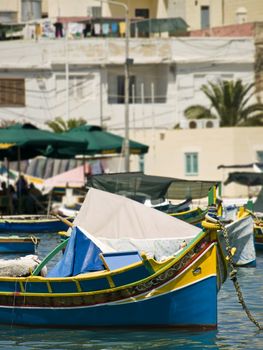 Traditional fishing boats of Malta in the fishing village of Marsaxlokk