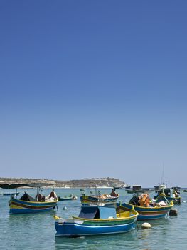 Traditional fishing boats of Malta in the fishing village of Marsaxlokk