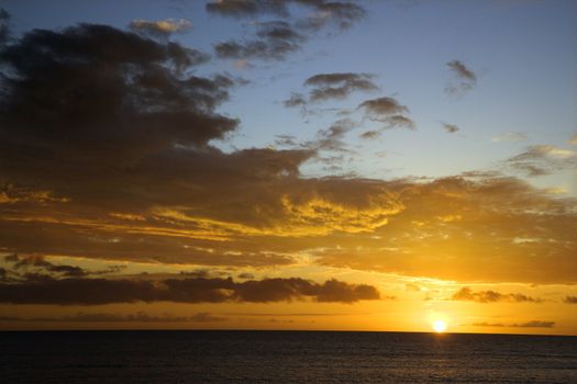 Sunset sky over the Pacific Ocean in Kihei, Maui, Hawaii, USA.