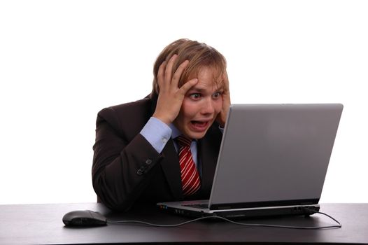 young businessman looking the laptop with hands on head