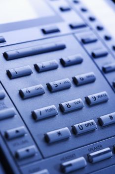 Close-up of a business telephone keypad.