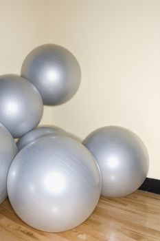 Balance balls stacked in gym.