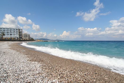 Hotel at a pebbly beach in the Greek island of Rhodos