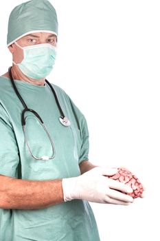 A 60 year old surgeon holding a brain, isolated on a white background.