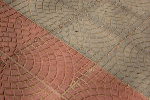 close-up of new old-style pavement of stoneblocks (bricks) of red color