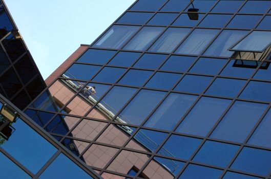 view of new modern office building of "steel and glass"against sky