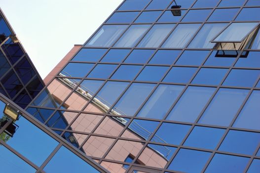 view of new modern office building of "steel and glass"against sky