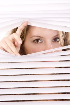 woman hands apart on the window blinds
