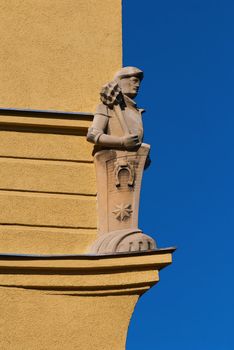 Sculpture of the knight at a corner of the house.