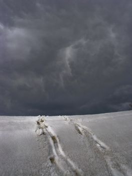 Steps and snow under grey sky