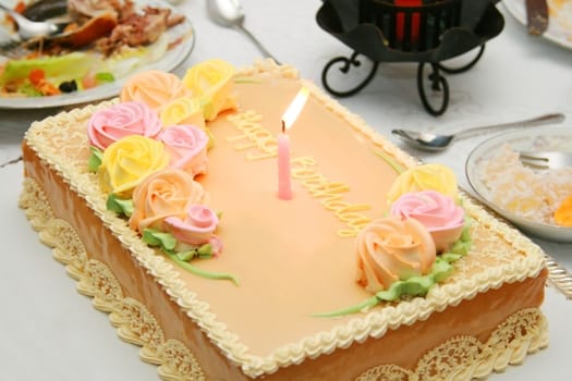 chiffon birthday cake with colorful flower icings
