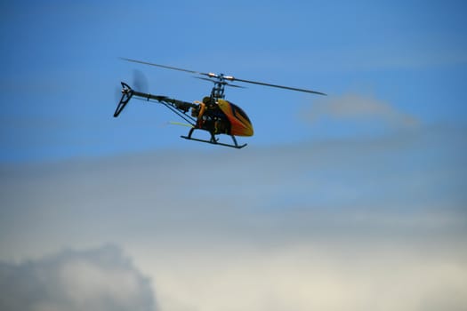 remote controlled toy helicopter in flight
