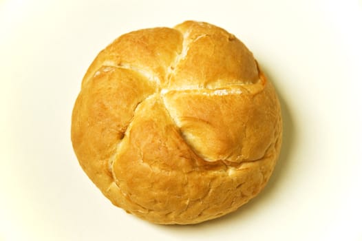 Bread roll on kitchen table.