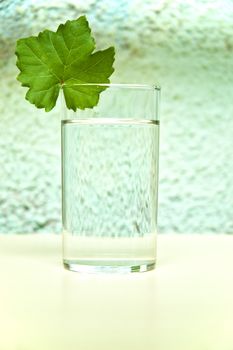 Glass of water on kitchen table.