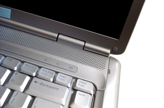 close-up of a silver laptop on a white background