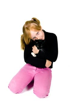 girl is holding young kitten