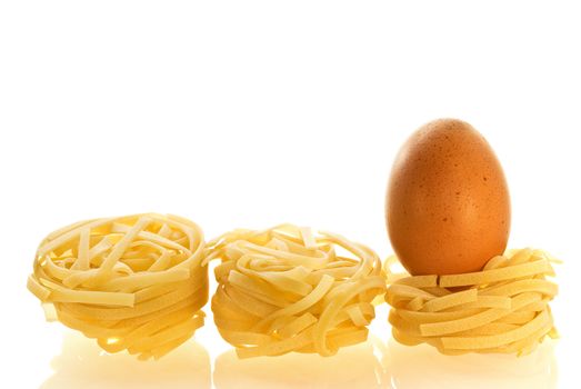 chikken egg as an ingredient of pasta over white background