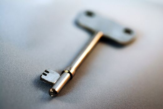 A close up photograph of a metal door key