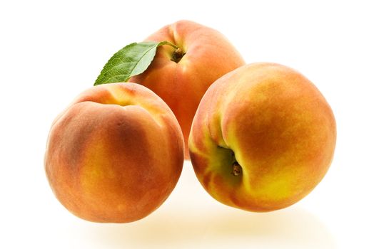 three ripe fresh peaches over white with light shadow