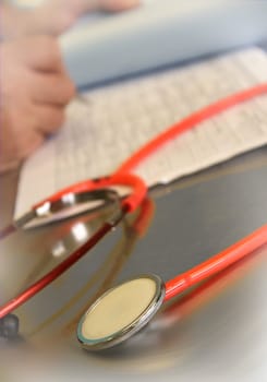 Close up of a red stethoscope, medical image