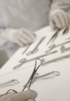 Doctor with surgical scissors at the operation room