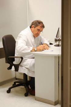 Doctor working in his office