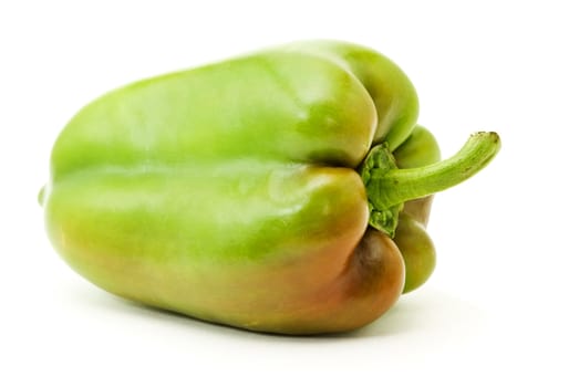 green bell-pepper with red side over white background