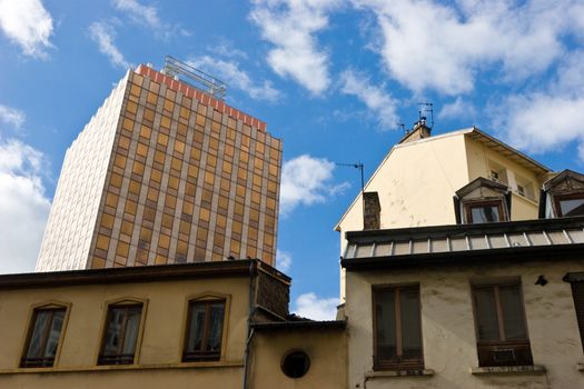 Modern office building behing old houses at the city of Lyon, France