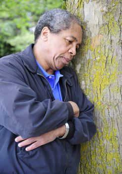 African american man isolated in the woods while feeling sad and rejected.