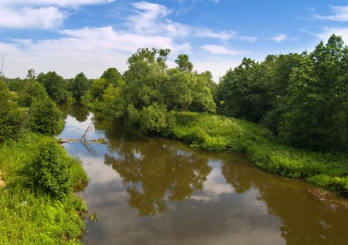 Summer landscape with river and blue sky