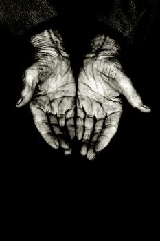 palms of a elderly woman, isolated on black copyspace