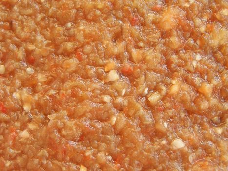 Close up of the caviar made of eggplants and tomatoes. Ukrainian cuisine.