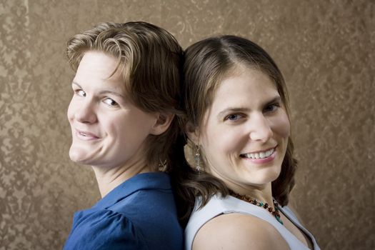 Portrait of Two Young Women Friends Back to Back