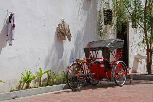 trishaw parked along a street