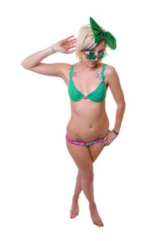 a woman in green with shamrock glasses for st patty's day