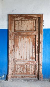The closed old decayed door