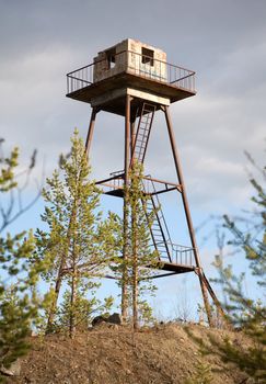 The thrown Russian watchtower in a wood