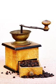 Antique coffee grinder with coffee beans