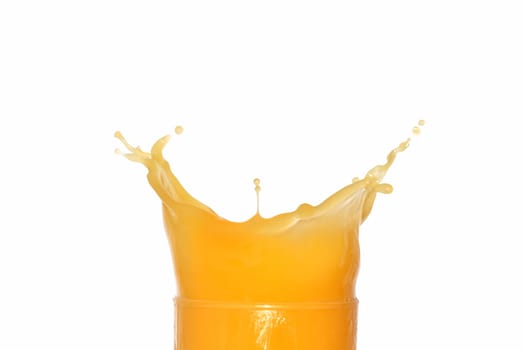 Closeup of splashing orange juice isolated on white background with clipping path