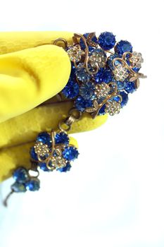 jewelry, household gloves, yellow gloves, blue lights, clean necklace
