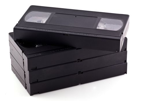 Pile of videotapes, isolated on a white background.