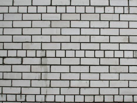 Old brick wall of white color