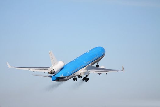 A middle size passenger jet, seconds after take off