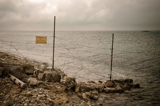 Fence Post with Barbed Wire on Coast