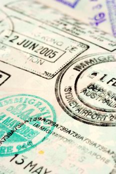 Macro / selective focus image of passport stamps.  Focus is in the middle.
