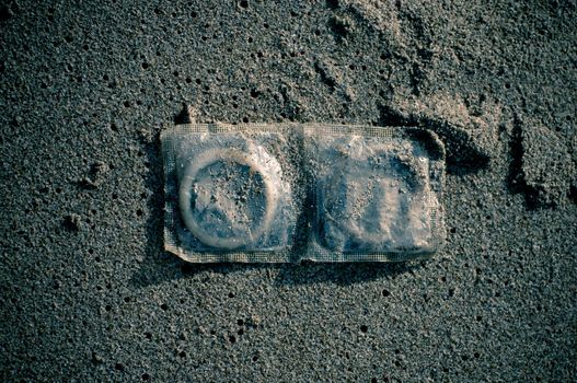 Condoms in sand