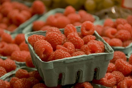 fresh raspberries at the market on a sunday